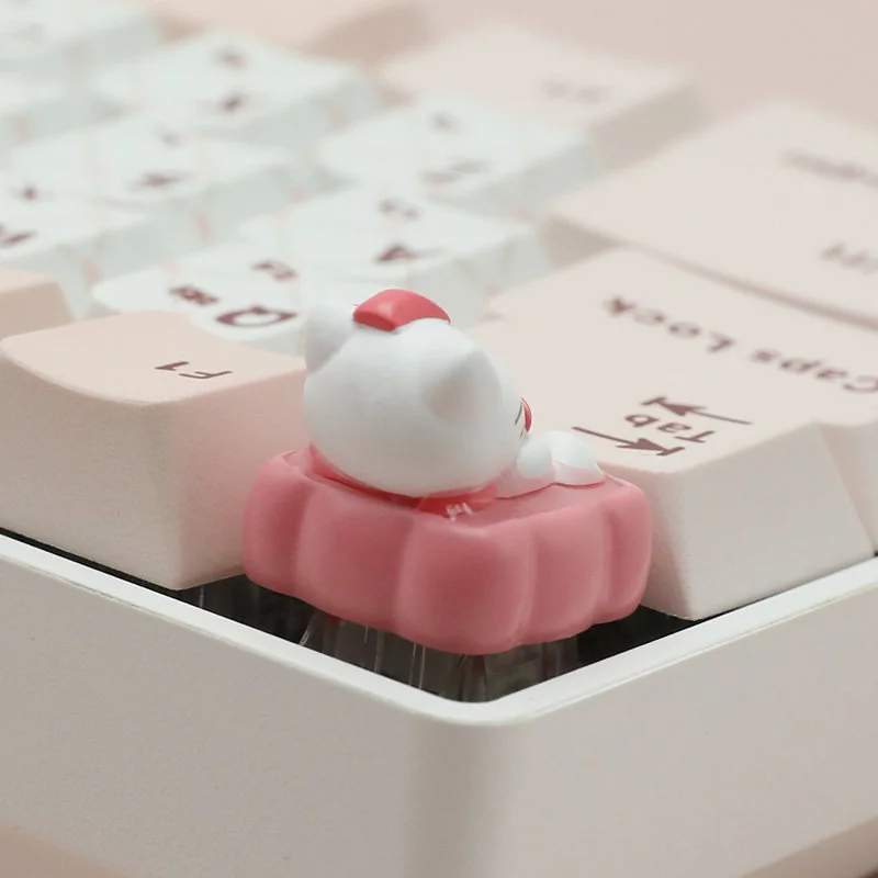 Close-up of a whimsical Hello Kitty dessert artisan ESC keycap, showcasing its adorable sweet treats and intricate details for a delightful desktop setup.