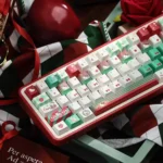 A playful Hello Kitty Christmas PBT keycaps set, showcasing festive hues keys with adorable character designs from multiple angles.
