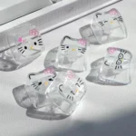 Playful Hello Kitty glitter backlit PC keycaps set, showcasing the transparent design with sparkling hearts and adorable cartoons.