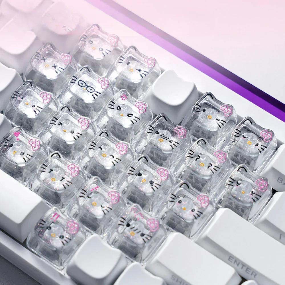 Playful Hello Kitty glitter backlit PC keycaps set, showcasing transparent designs with cute cat faces and sparkling hearts.