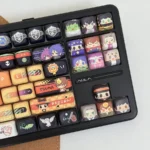 Exclusive Hitman Reborn Chibi PBT Supplement keycap set displayed from a dynamic angle, featuring vibrant, playful anime characters for custom keyboards.
