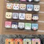 Vibrant main display of the exclusive Hitman Reborn Chibi PBT Supplement Keycaps Set, showcasing playful anime characters perfect for any custom keyboard.