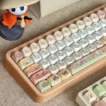 A charming Q-version Collectible Hollow Knight Silksong Hornet keycap set, showcasing intricate artisan details and vibrant game-inspired colors from multiple angle.