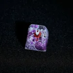 Close-up of a unique hand-painted Hornet Hollow Knight translucent ESC keycap, showcasing its intricate glowing design and artistic dark fantasy style.