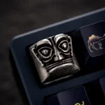 Unique pure copper Sanxingdui Mask keycap, Style Two, artfully blending ancient bronze mystique with whimsical charm for custom keyboards.