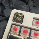 Detailed view of a premium vintage brass Japanese Oni keycap, a handcrafted artisan piece with an iconic samurai mask design.