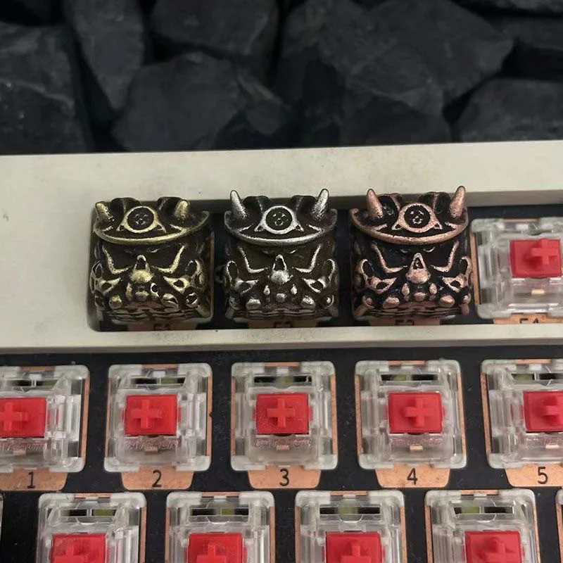 A striking handcrafted Japanese Oni Keycap featuring a detailed samurai mask design with vintage finishes.