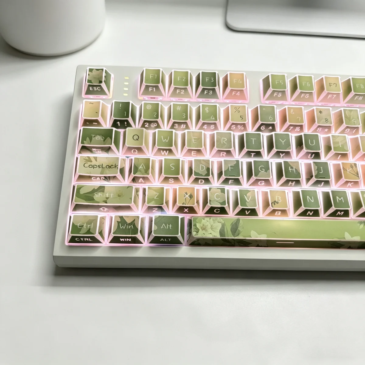 Jasmine Snow Bud PBT Keycaps Set with translucent side-engraved legends and delicate jasmine floral design, emphasizing artistic light reflections.