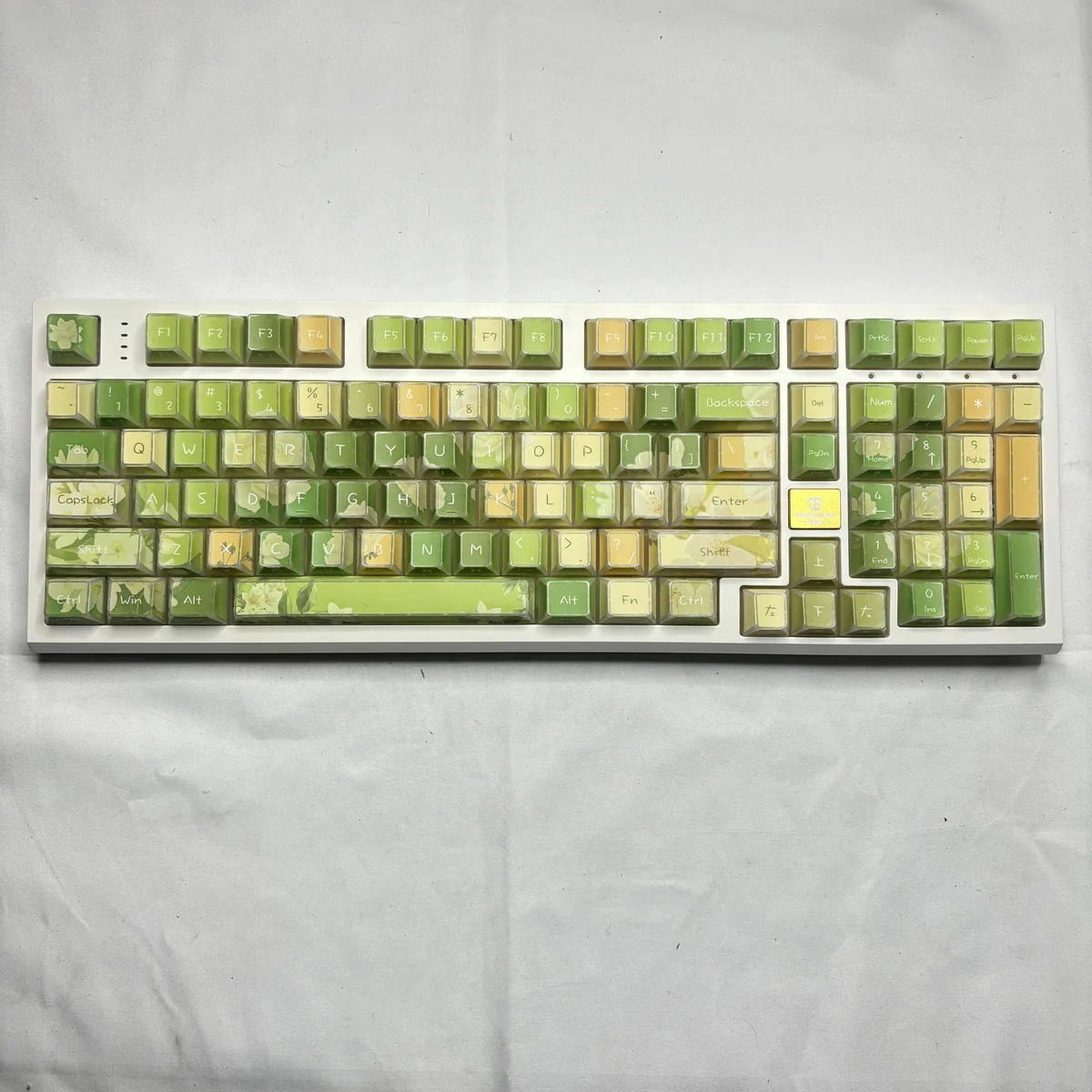 Elegant Jasmine PBT Keycaps Set main image, featuring translucent side-engraved legends with delicate jasmine florals and modern angles, enhanced by subtle angle.