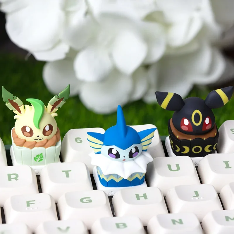 Whimsical Leafeon cake artisan ESC keycap, an adorable Pokemon collectible. Detailed views showcase its unique design and intricate craftsmanship.