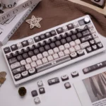 Product gallery of the exclusive Lolita Cocoa PBT keycap set, highlighting its sweet romantic aesthetic, warm cocoa tones, delicate patterns, and vintage design.
