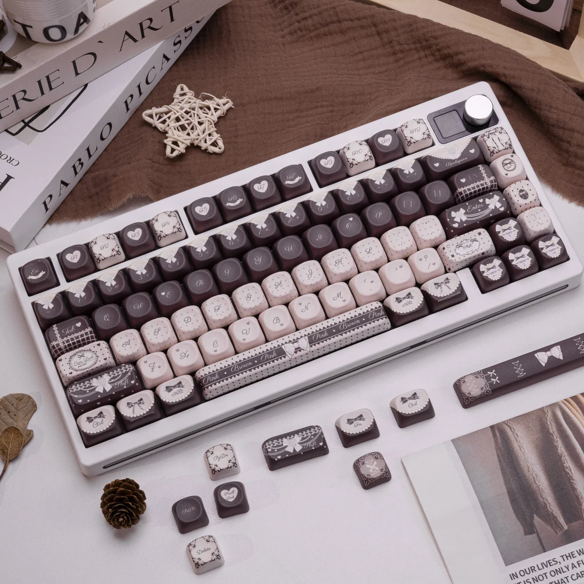 Product gallery of the exclusive Lolita Cocoa PBT keycap set, highlighting its sweet romantic aesthetic, warm cocoa tones, delicate patterns, and vintage design.