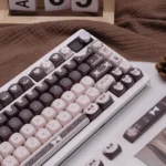 Artistic view of the Sweet Elegance Lolita Cocoa PBT keycap set, featuring warm cocoa hues, delicate patterns, and exclusive designer details.