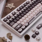 Detailed view of the Sweet Elegance Lolita Cocoa PBT keycap set, highlighting its exclusive designer patterns, warm cocoa tones, and charming vintage design.