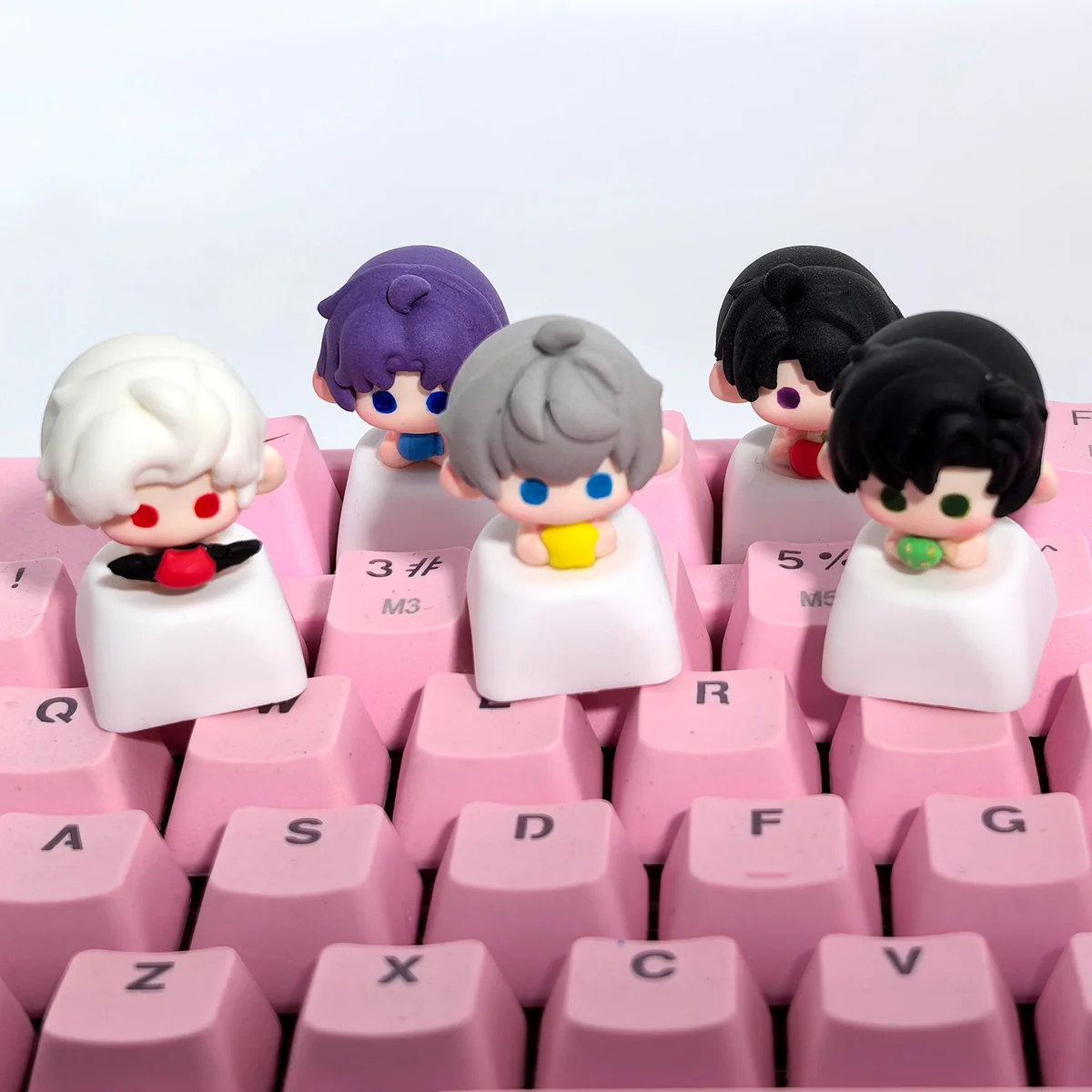 Close-up of a meticulously handcrafted clay artisan Love and Deepspace game character keycap, showcasing vibrant details and artistic sculpting design.