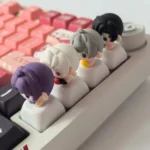 Vibrant handcrafted clay artisan Love and Deepspace character keycap, intricately sculpted and shown from multiple artistic angles, highlighting its characters detailed.