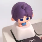 Vibrant handcrafted clay artisan keycap showcasing the Love and Deepspace character Rafayel, intricately sculpted with rich, game-accurate details