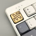 Handcrafted striped milky yellow artisan resin keycap, featuring a luxurious textured finish inspired by gourmet chocolate, offering a unique and art.