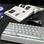 A collection of premium luminous Metallic Paint silver PC keycaps set, showcasing their sleek finish and glowing sculpted legends from various angles.