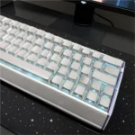 Premium luminous Metallic Paint silver PC keycaps set from various angles, highlighting its sleek finish and glowing sculpted legends.