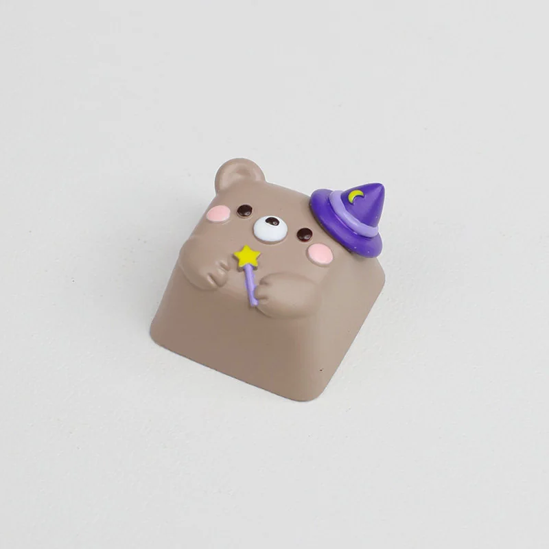 Close-up of the handcrafted Magic Bear artisan ESC keycap, revealing its whimsical forest creature design and enchanting, playful details from a unique design.