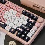 Close-up views of the adorable black and pink maid cat keycap set from various angles, highlighting its charming, playful design and unique aesthetic.