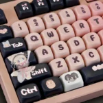 Adorable black and pink maid cat keycap set from multiple angles, highlighting its playful design and unique aesthetic for mechanical keyboards.