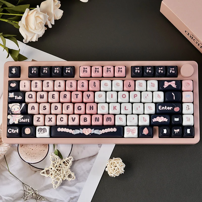 Adorable black and pink maid cat keycap set showcasing its charming, playful design and unique aesthetic as a delightful keyboard accent.