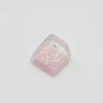 Whimsical handcrafted resin Maltese dog ESC keycap, top-down view, revealing a charming line-art Maltese in a playful outfit, encased in clear resin.
