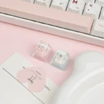 Whimsical handcrafted resin Maltese Dog Keycap featuring a charming line-art Maltese in a playful outfit, encased in clear resin, ideal for an ESC key.