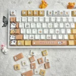 Adorable Maltese dog PBT keycaps set, featuring charming line art and a playful spa theme in warm brown tones.