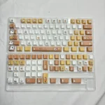 Close-up of adorable Maltese dog PBT keycaps set featuring charming line art designs in warm tones, highlighting the playful spa theme from a unique design.