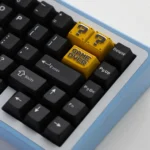 Premium zinc alloy Super Mario Question Block keycap, showcasing its iconic pixelated design from a distinct angle. This vibrant, durable Mario keycap.