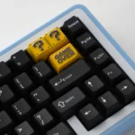 This premium zinc alloy Super Mario Question Block backspace keycap, viewed from a striking angle, reveals its iconic pixelated design and vibrant design.