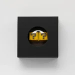 Premium zinc alloy Super Mario Question Block backspace keycap, a playful variant with a vibrant yellow and sleek silver double question mark design.