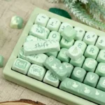 Gallery of Matcha Green PBT MOA Keycaps Set from multiple angles, revealing the gentle colors, evoking a serene spring outing design.