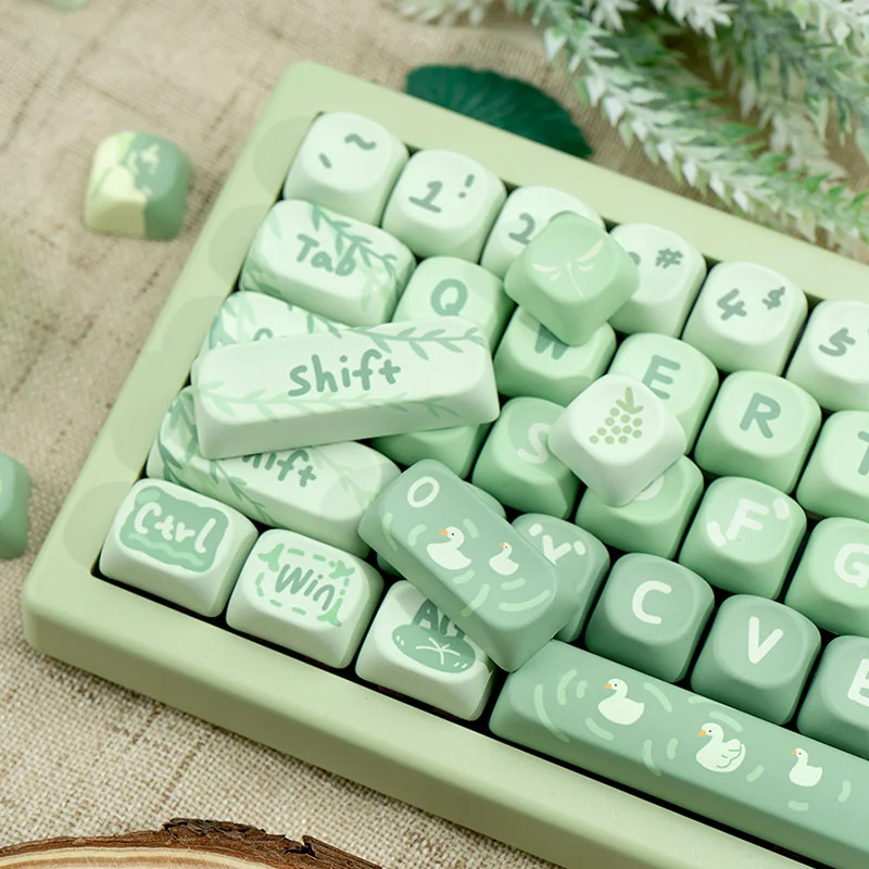 Gallery of Matcha Green PBT MOA Keycaps Set from multiple angles, revealing the gentle colors, evoking a serene spring outing design.
