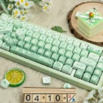 Artistic close-up of the Matcha Green PBT MOA Keycaps Set, showcasing the gentle hues inspired by a serene spring outing.