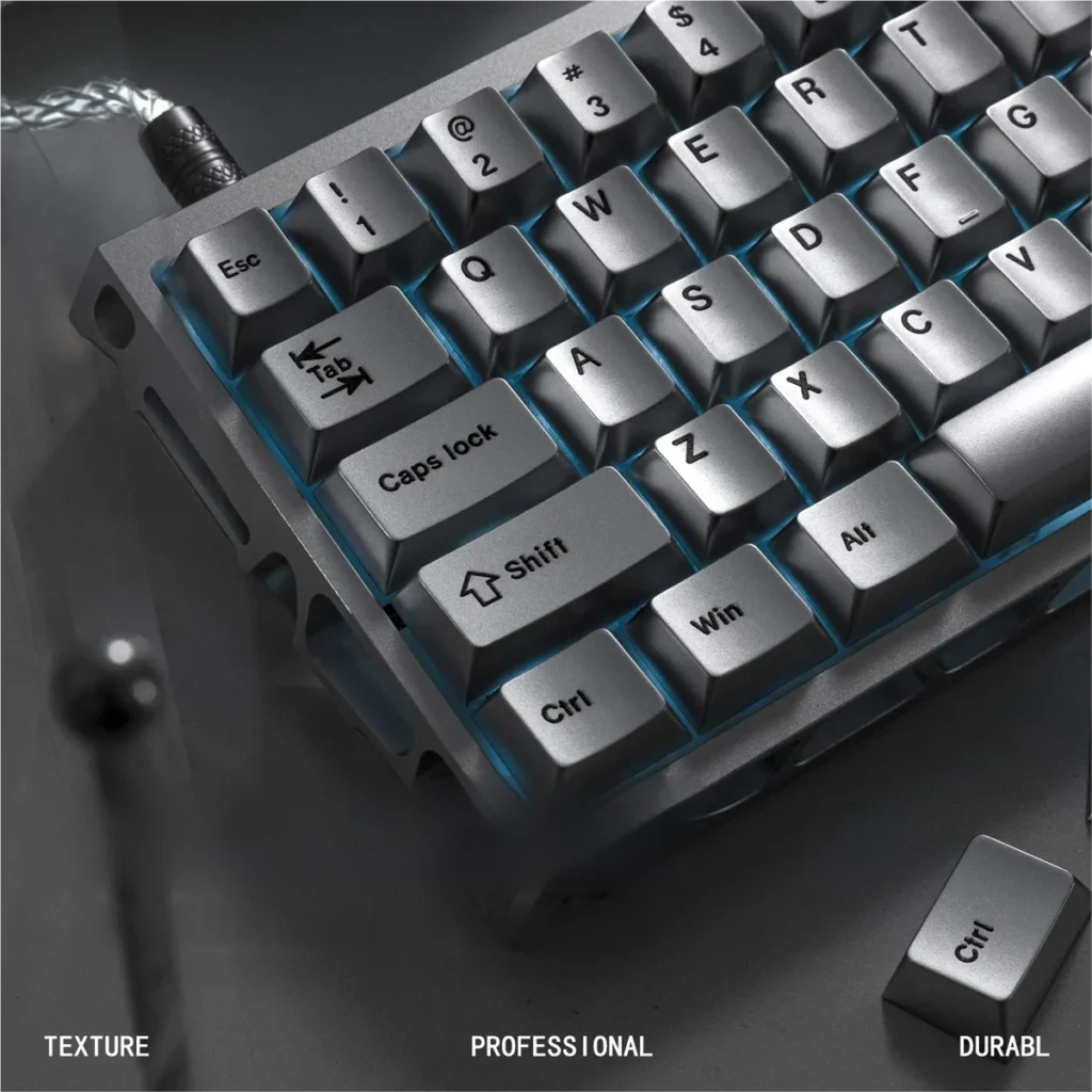 Metallic silver PBT keycaps, close-up view. Keyboard not included.