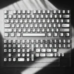 Sleek Metallic silver PBT keycap set shown from multiple angles, highlighting its premium minimalist design and modern sophistication for an elevated keyboard.