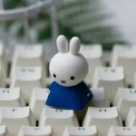 Detailed view of the adorable Miffy & Friends handcrafted resin ESC keycap, showcasing its vibrant, whimsical characters and charming design from a unique design.