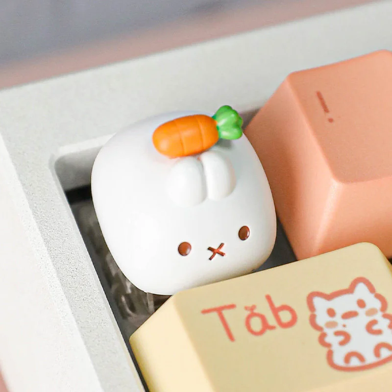 Playful handcrafted Miffy carrot resin keycap for Esc key, shown from a whimsical angle, highlighting its sculpted details and vibrant colors.
