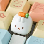Handcrafted Miffy carrot resin keycap for Esc key, viewed from different angles. The whimsical Miffy character, sculpted in resin, adds a playful touch.