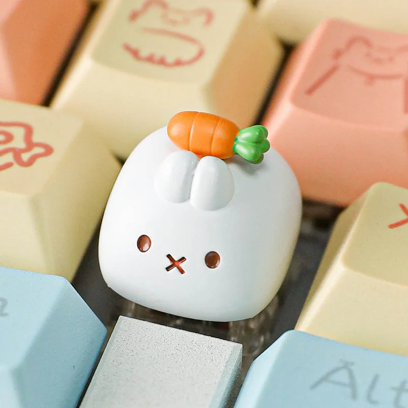 Handcrafted Miffy carrot resin keycap for Esc key, viewed from different angles. The whimsical Miffy character, sculpted in resin, adds a playful touch.