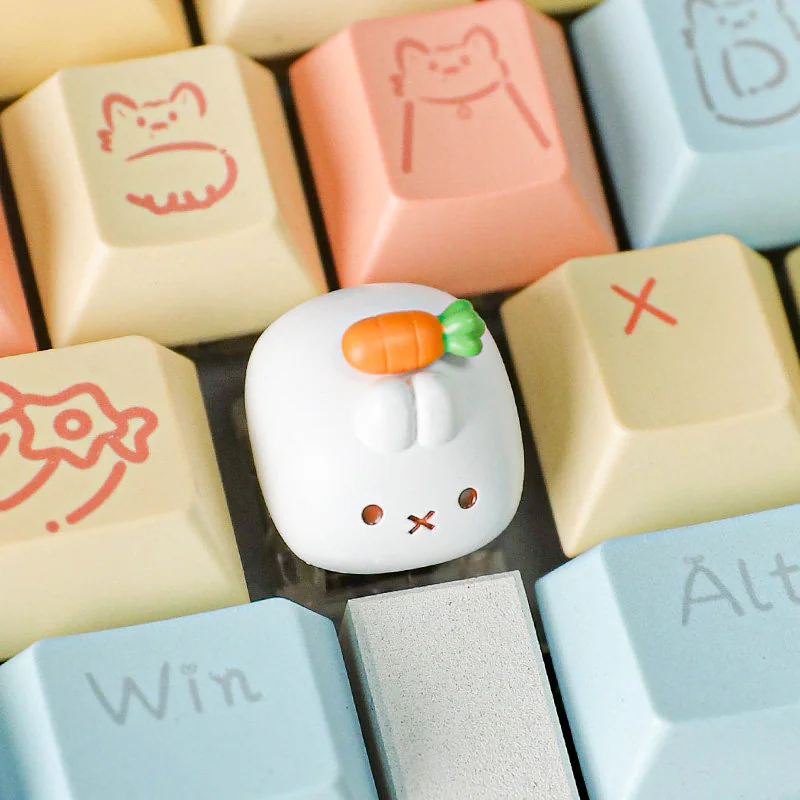 A whimsical handcrafted Miffy Carrot resin keycap for the Esc key, showcasing its detailed sculpting and playful design from multiple angles on a desk.