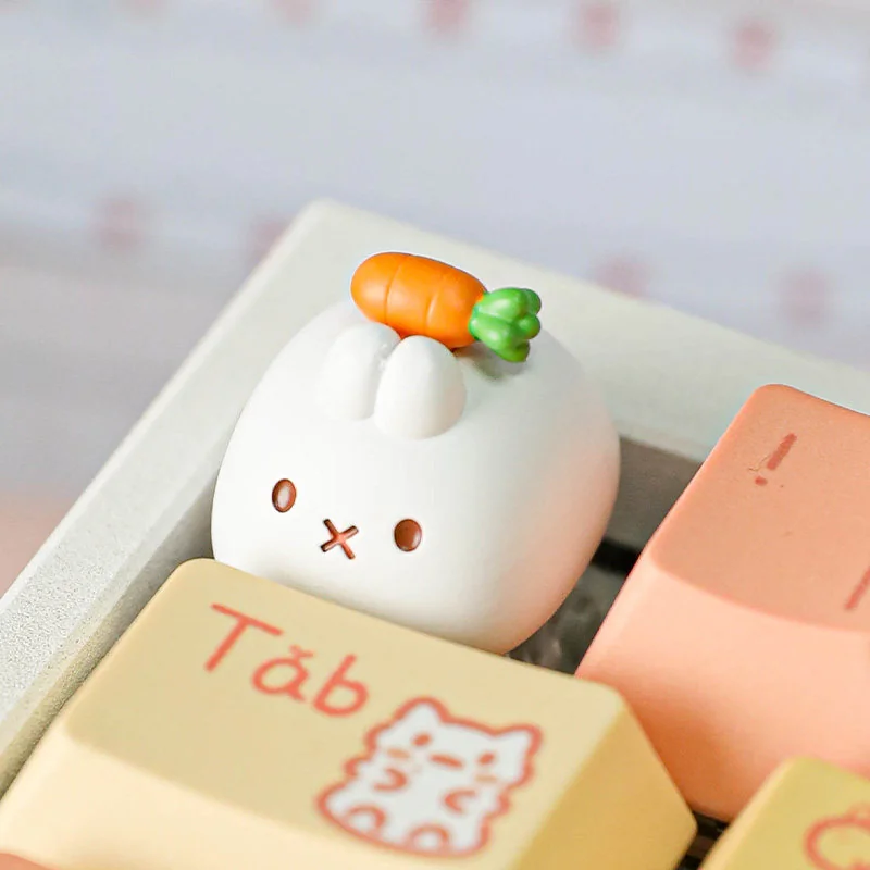 A whimsical handcrafted Miffy Carrot resin keycap for the Esc key, shown from various playful angles, highlighting its sculpted details and vibrant angle.