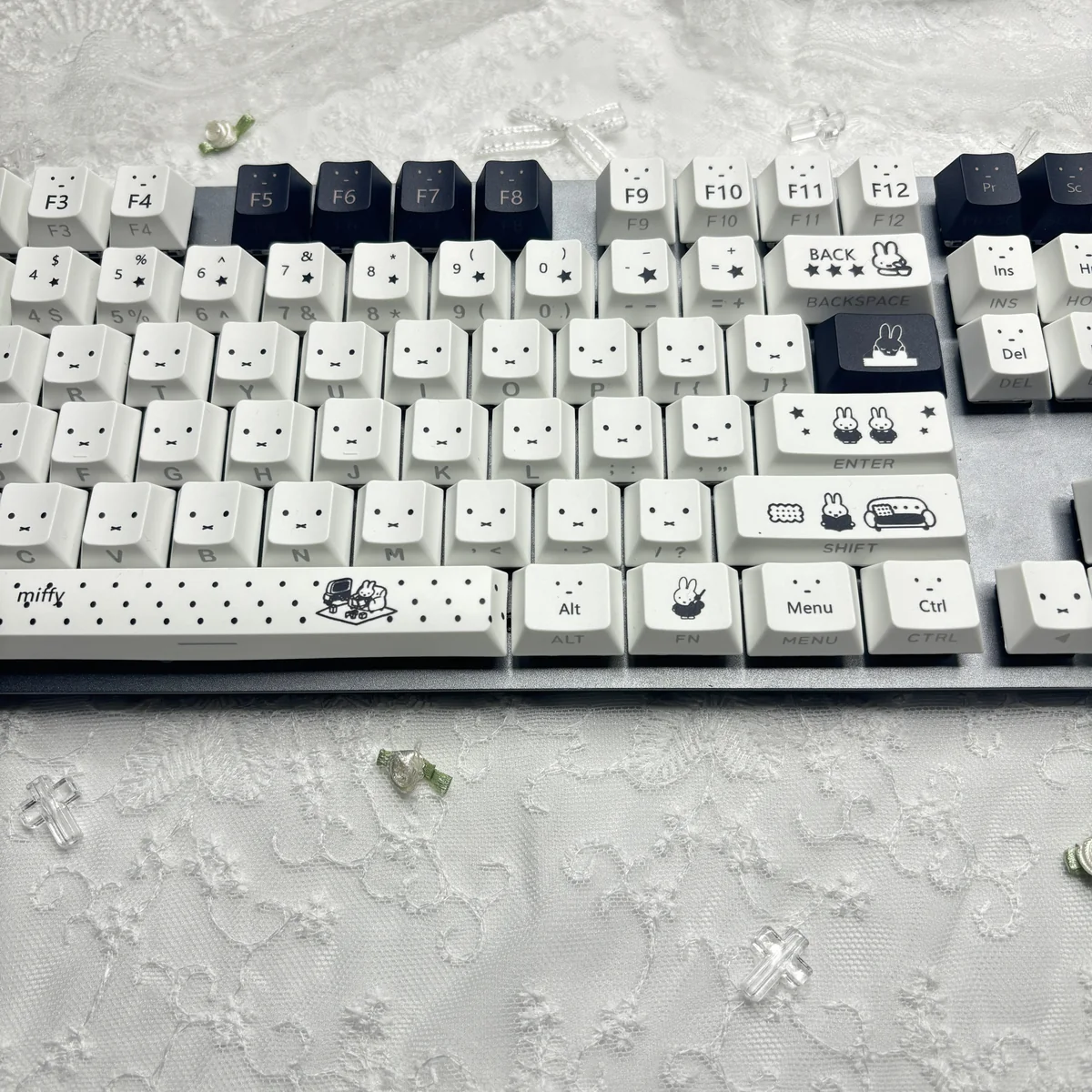 Close-up of the iconic Miffy PBT keycaps set, showcasing the durable texture and crisp backlit legends in a playful design, perfect for joyful typers.