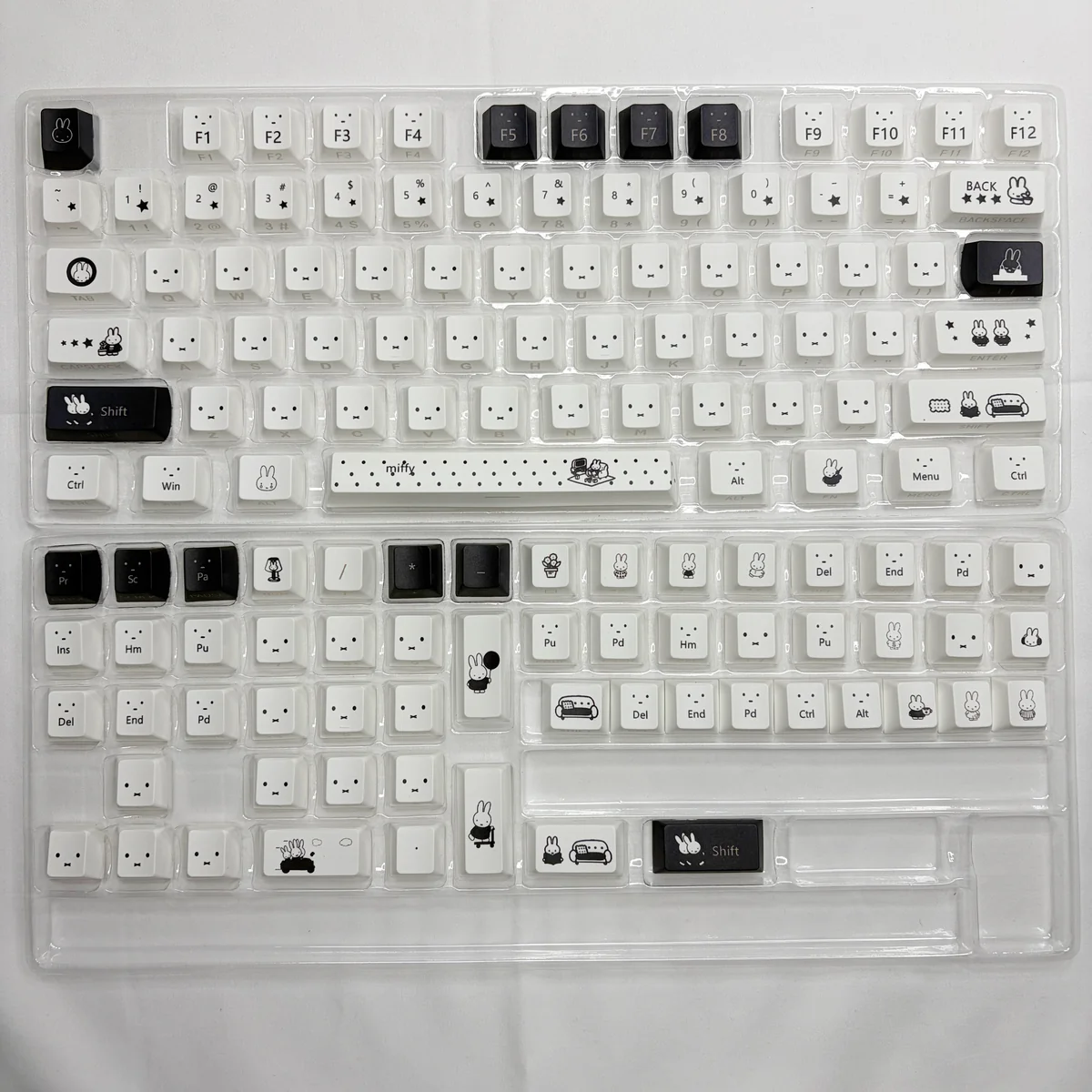 Detailed shot of Miffy PBT keycaps set, displaying iconic Miffy & Friends characters in crisp design. Durable and backlit for joyful typing.