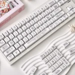 Close-up of the charming Miffy Pixel Art Keycap Set, showcasing gentle pixelated Miffy characters in a soft, whimsical retro style on a mechanical keyboard.