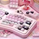 Premium Mikko PBT keycaps set, showcasing its durable 5-sided dye-sub legends in a playful black, white and pink design from multiple angles.